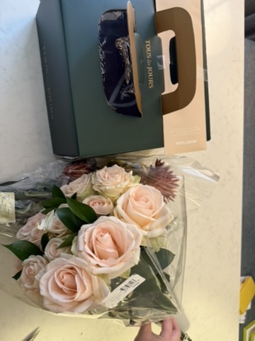A holiday flower and gift arrangement